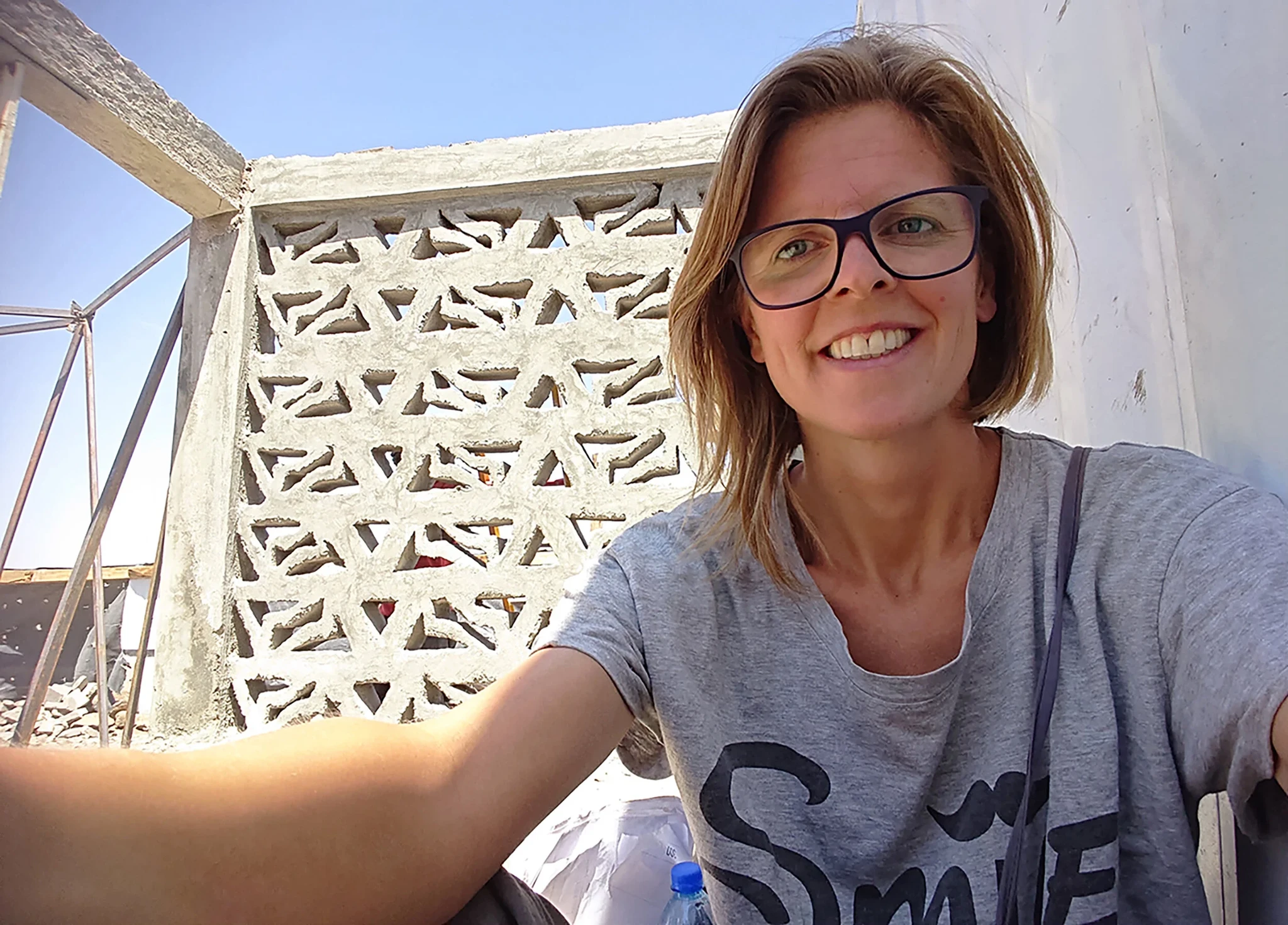 Narda in front of the unique concrete ventilation blocks in the shape of Klabu’s logo
